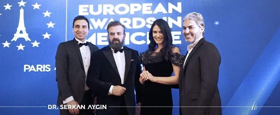 Online dermatologist Dr. Serkan Aygin receiving the Best in Europe 2019 Medical Paris Award